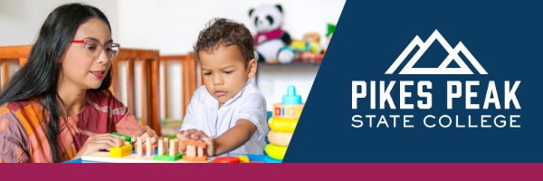 ECE student working with toddler on puzzle in a classroom