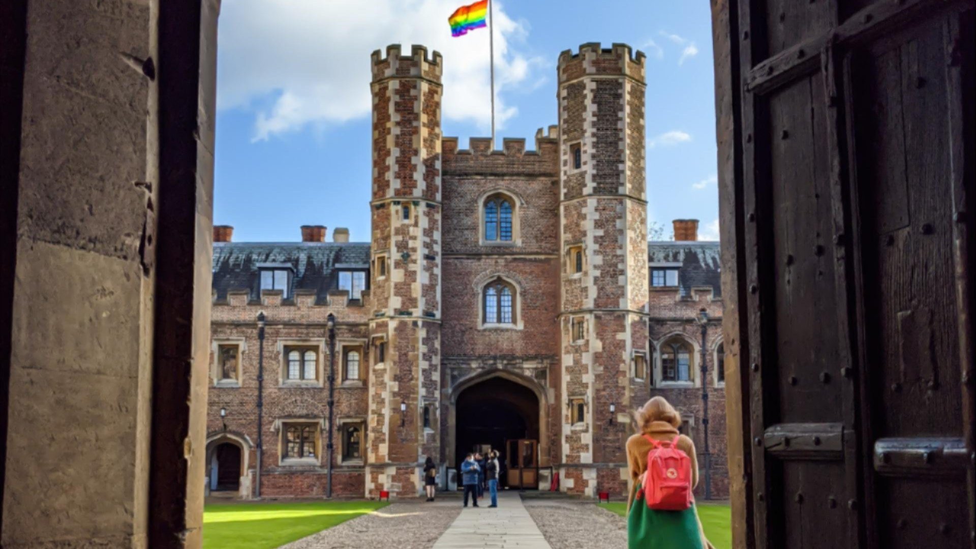 Looking through a doorway on to a college quad.