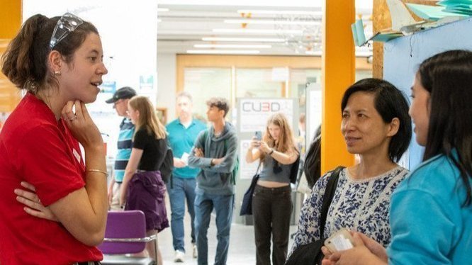 A parent and prospective student speaking to an adviser during an Open Day